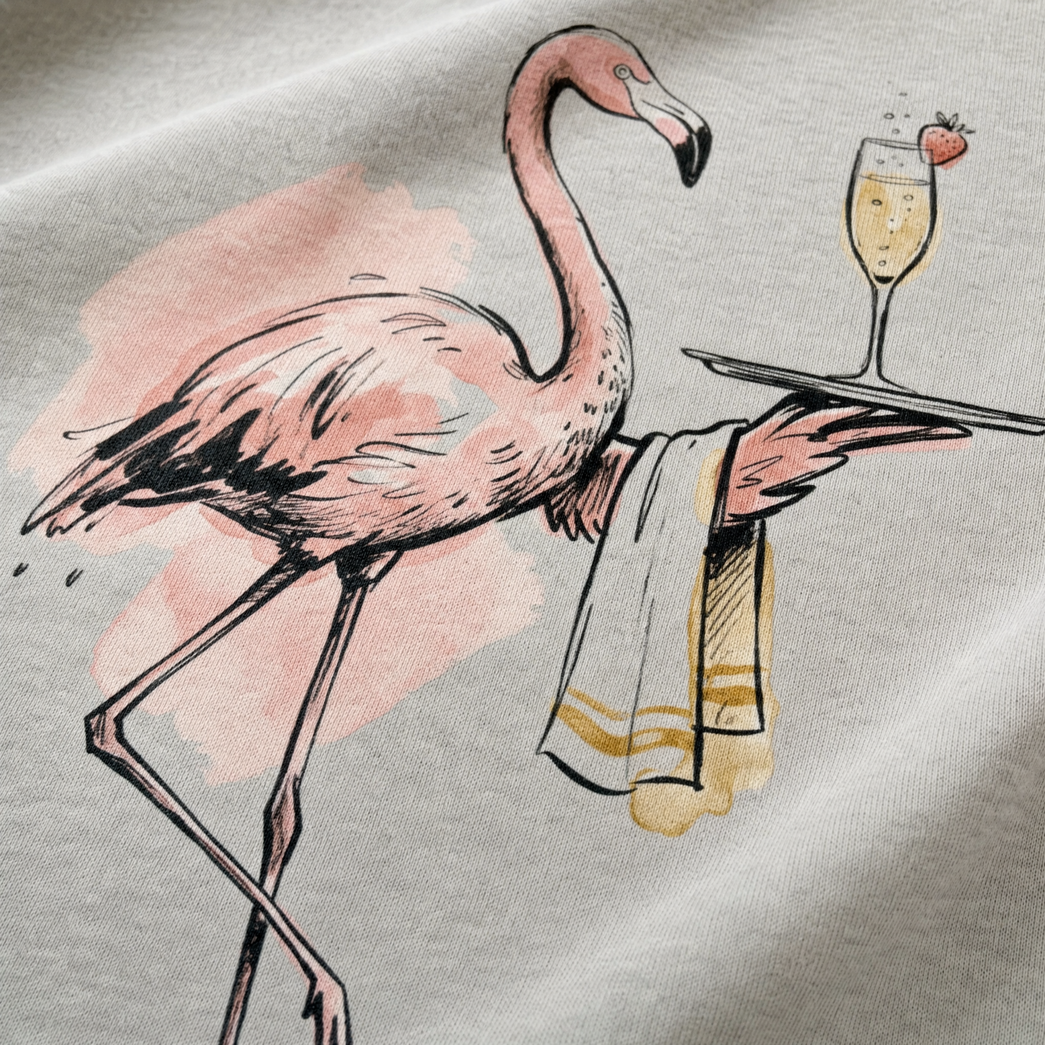 Pale grey t-shirt printed with a flamingo waiter carrying a cocktail on a tray