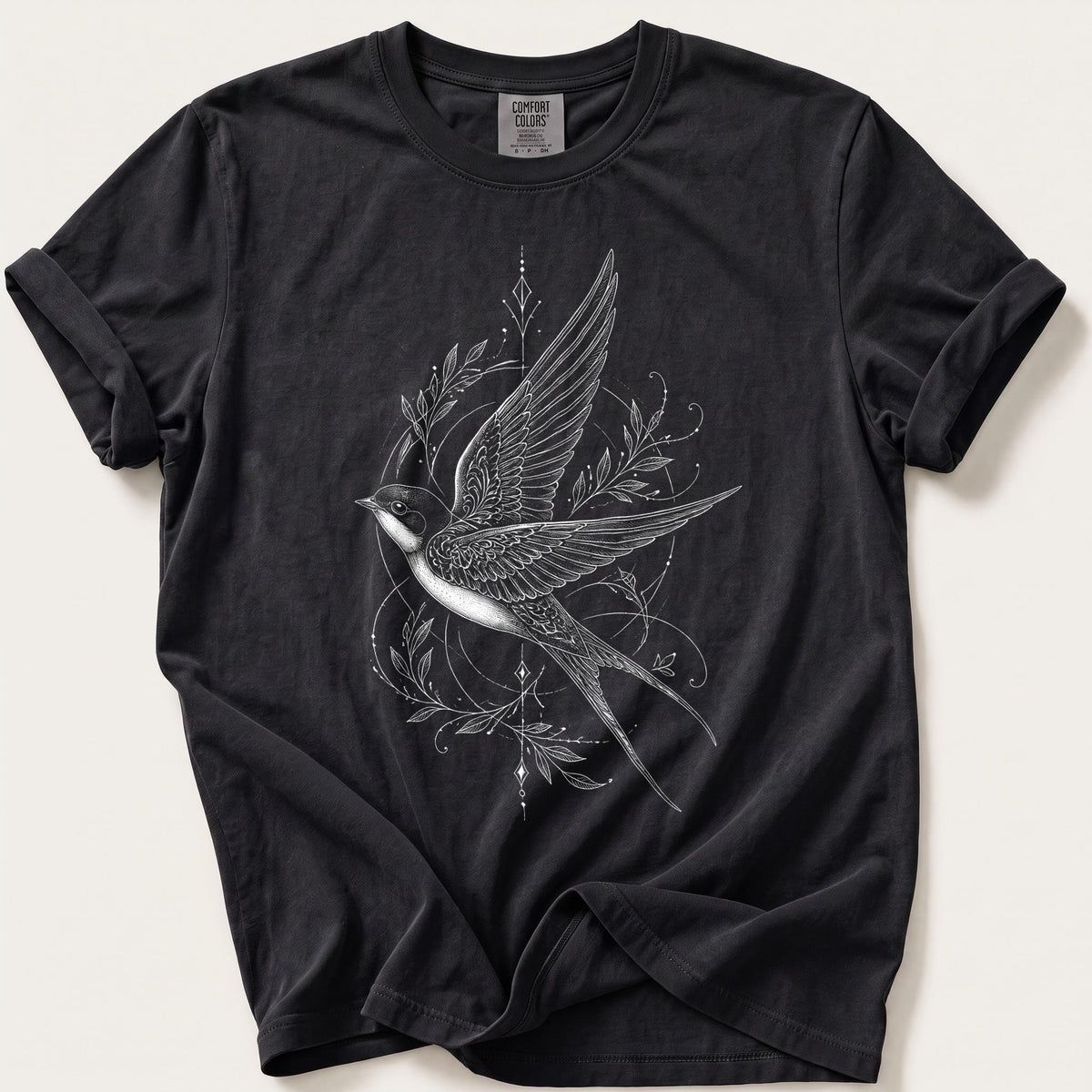 Fine Line Swallow Ornament — Black Comfort Colors tee