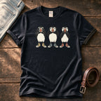 See Hear Speak Puffins 5 — Black Comfort Colors tee